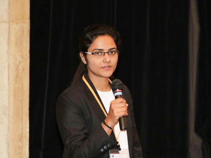 An aluma speeks to the attendees