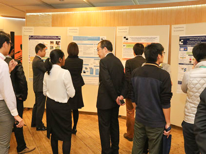 At networking reception posters represinting research results are on exhibit.
